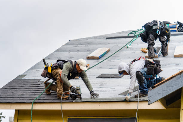 Professional Roofing technician working in Hewlett, NY